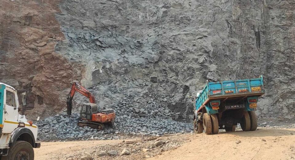 Excavator and trucks engaged in minor mineral excavation at a quarry site in Maharashtra amid the government’s crackdown on illegal mining activities.