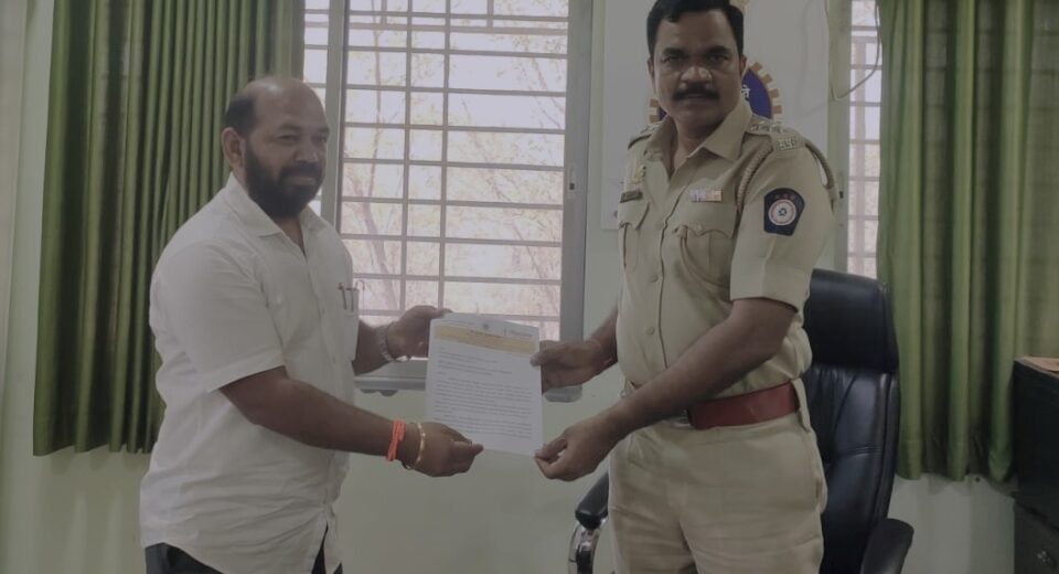 Shiv Sena (UBT) transport wing leader Subhash More submitting a memorandum to Pen RTO officer Madhav Suryavanshi demanding action against overloaded coal transport on the Mumbai–Goa Highway.