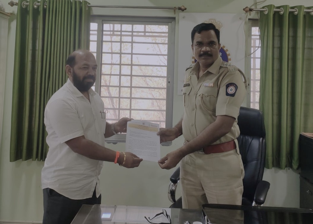 Shiv Sena (UBT) transport wing leader Subhash More submitting a memorandum to Pen RTO officer Madhav Suryavanshi demanding action against overloaded coal transport on the Mumbai–Goa Highway.