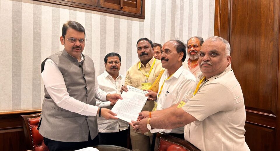 Maharashtra Chief Minister Devendra Fadnavis receiving memorandum from Municipal Mazdoor Union representatives regarding housing scheme for sanitation workers in Mumbai