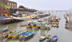 Fishing boats docked at a Koliwada jetty in Mumbai highlighting the traditional fishing community amid Dharavi boundary demarcation issue