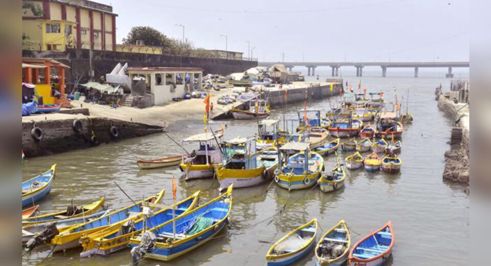 Fishing boats docked at a Koliwada jetty in Mumbai highlighting the traditional fishing community amid Dharavi boundary demarcation issue