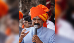 Fattesinh Sawant speaking at a public event, appealing to youth to protect Raigad Fort and preserve historical heritage