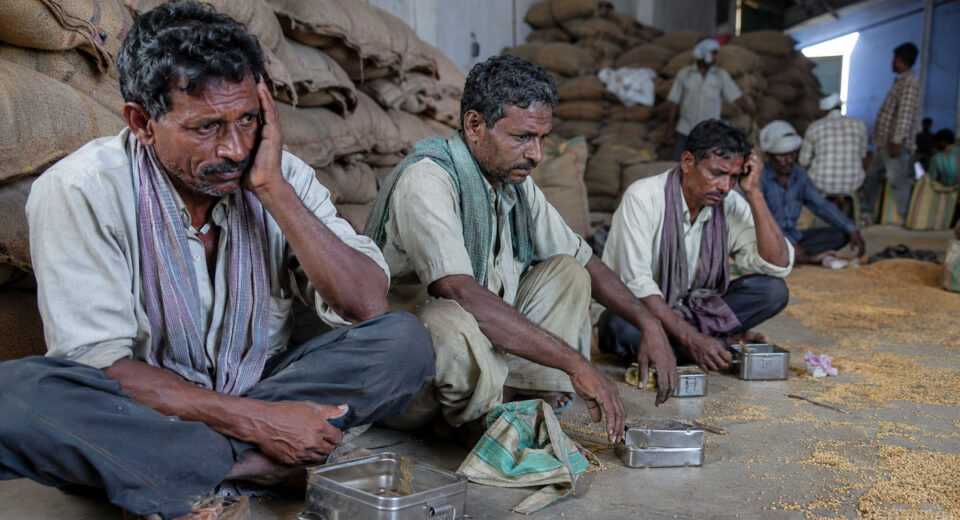 Mathadi workers at government warehouse protesting unpaid wages in Satara