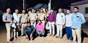 Forest Department officials with seized khair wood logs and pickup vehicle after intercepting an alleged timber smuggling operation in Kashadi Ghat near Poladpur on the Mumbai-Goa Highway.