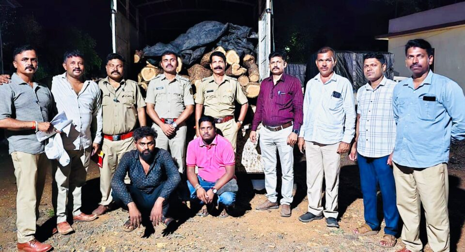 Forest Department officials with seized khair wood logs and pickup vehicle after intercepting an alleged timber smuggling operation in Kashadi Ghat near Poladpur on the Mumbai-Goa Highway.