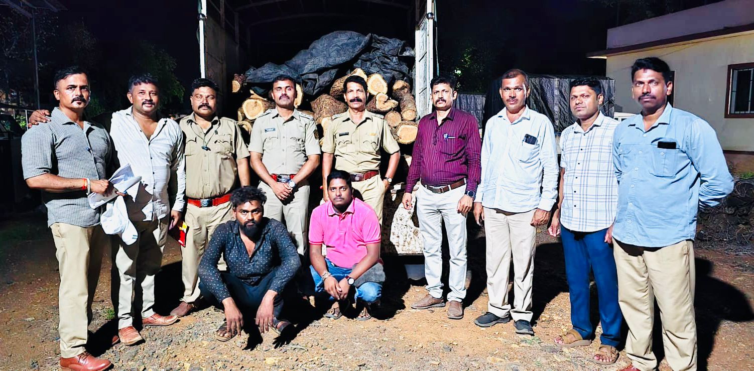 Forest Department officials with seized khair wood logs and pickup vehicle after intercepting an alleged timber smuggling operation in Kashadi Ghat near Poladpur on the Mumbai-Goa Highway.
