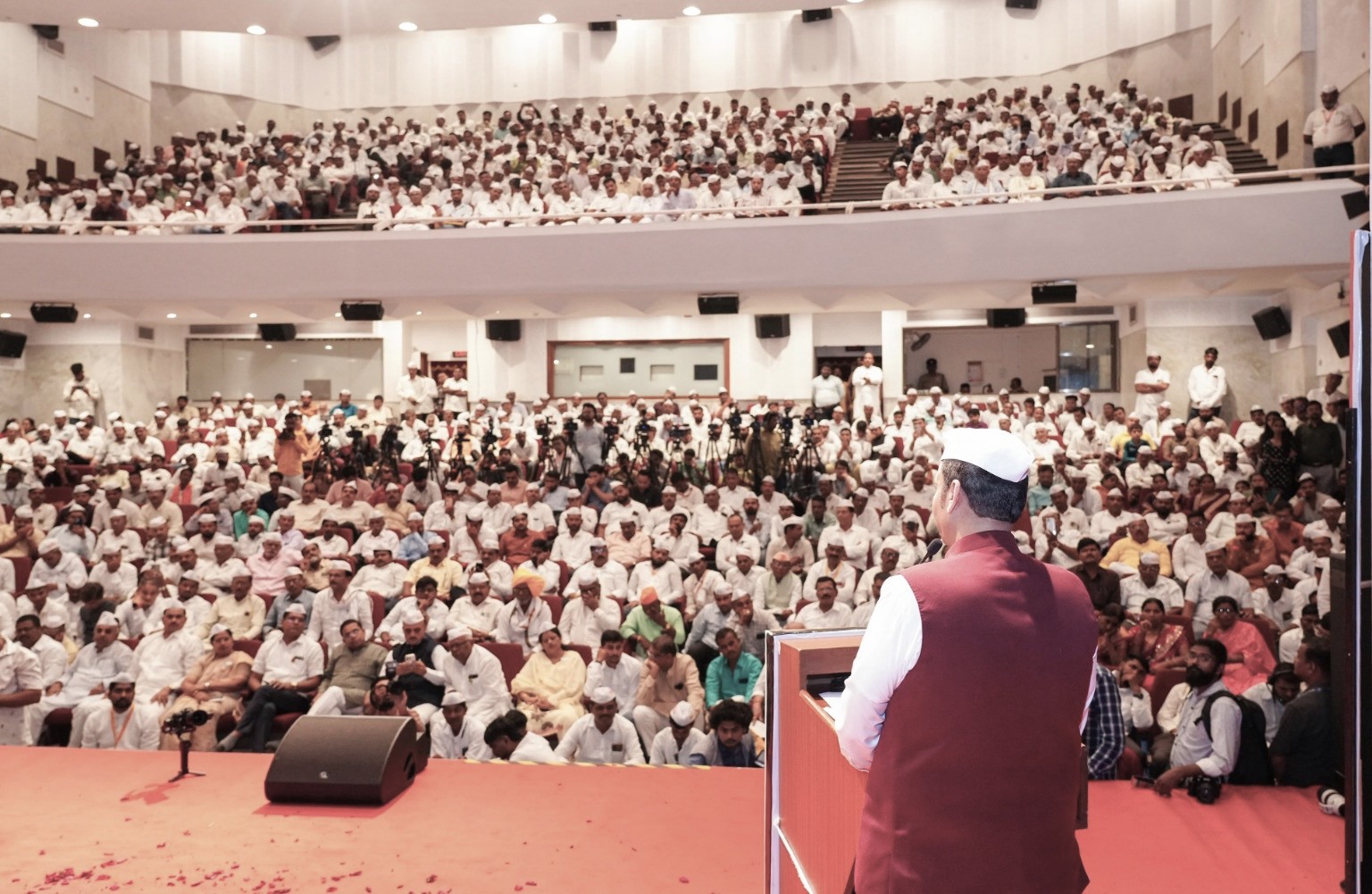 Chief Minister Devendra Fadnavis announcing the agricultural electricity bill waiver package at a farmers' gathering in Maharashtra.
