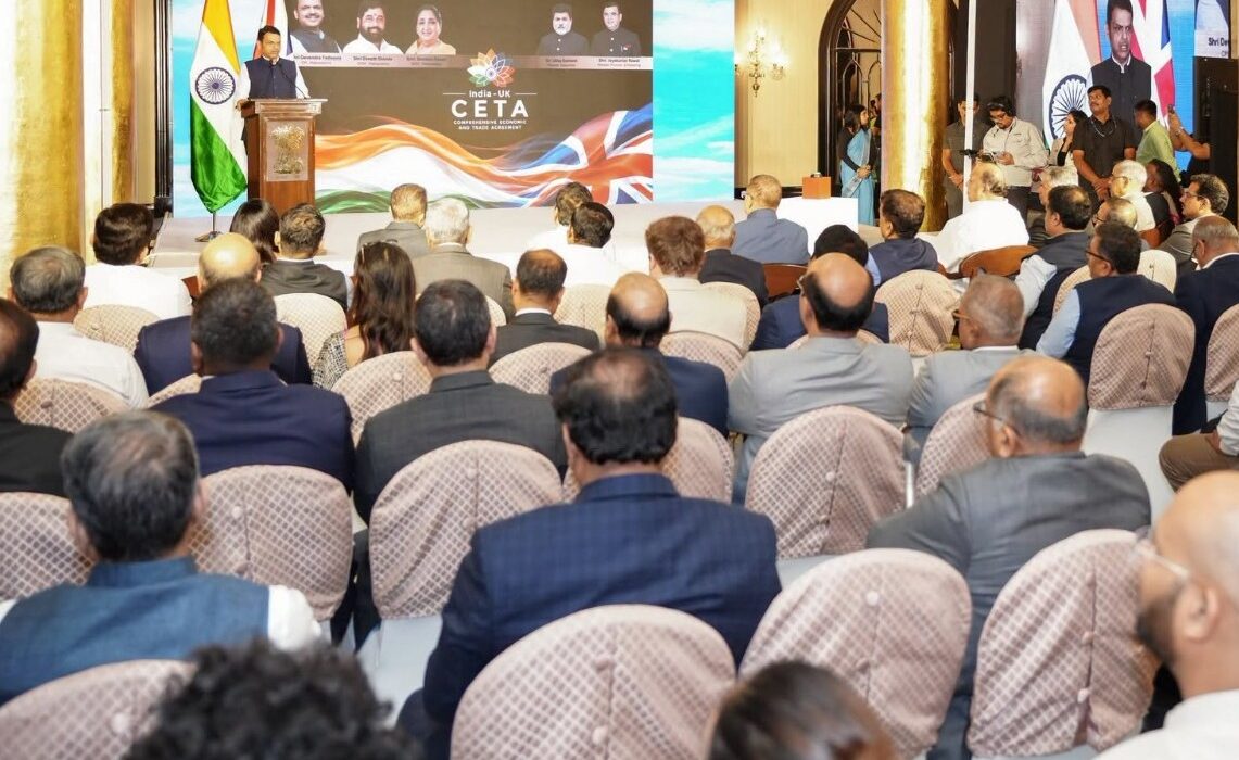 Chief Minister Devendra Fadnavis addresses industry leaders during the launch of the India–UK Comprehensive Economic and Trade Agreement implementation in Mumbai.