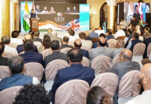 Chief Minister Devendra Fadnavis addresses industry leaders during the launch of the India–UK Comprehensive Economic and Trade Agreement implementation in Mumbai.