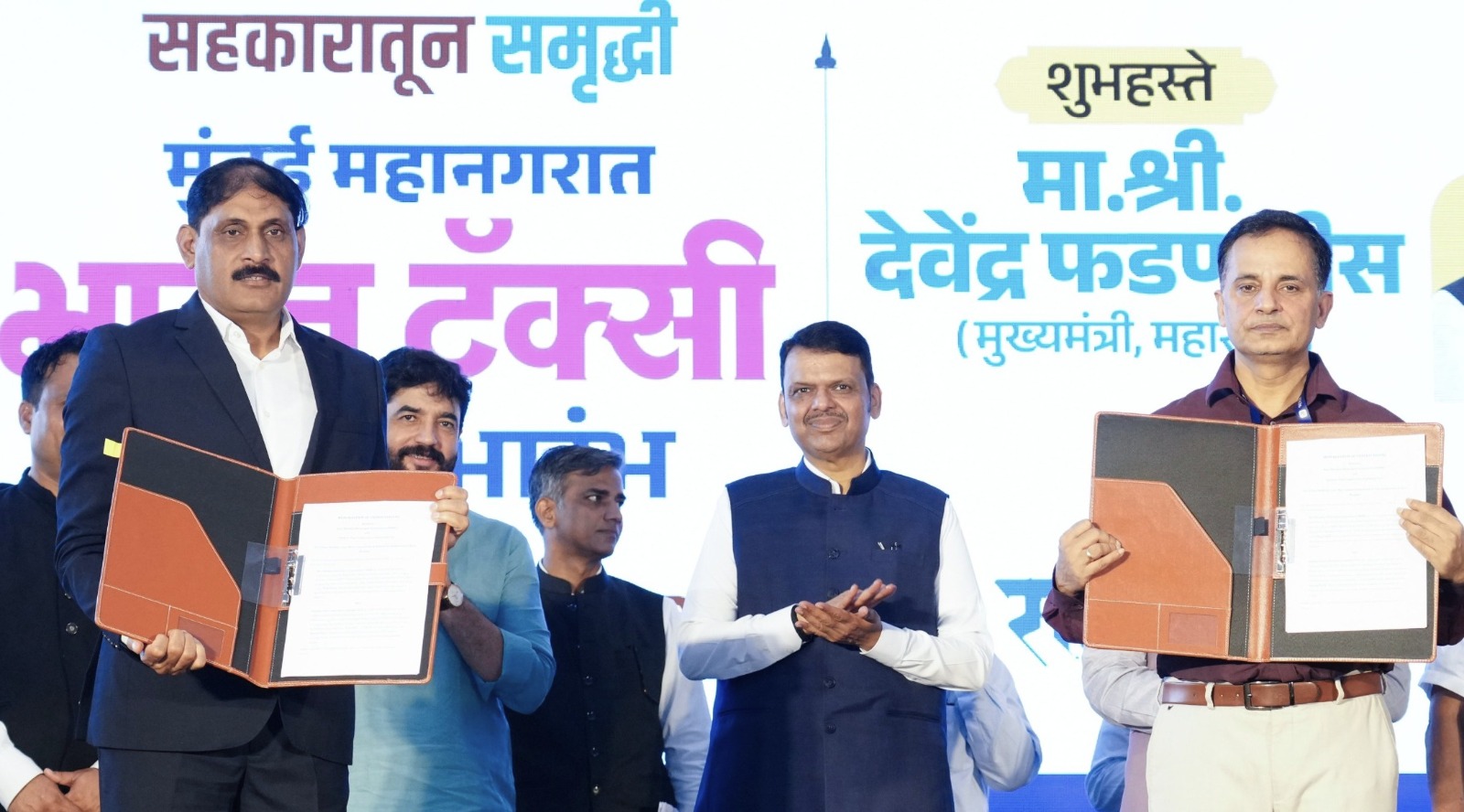 Chief Minister Devendra Fadnavis attends the launch of the Bharat Taxi cooperative mobility service during an event in Maharashtra.