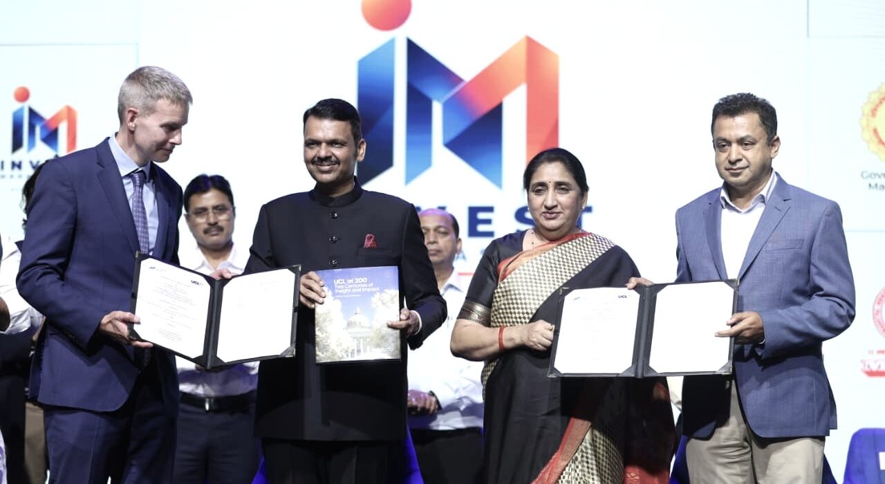 MMRDA and University College London representatives display signed MoU documents at the Invest Maharashtra event