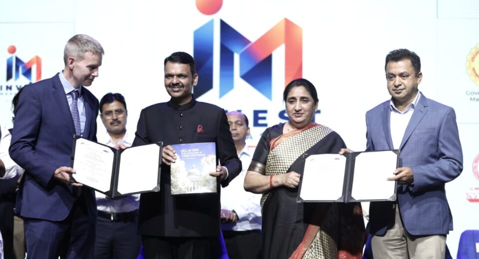 MMRDA and University College London representatives display signed MoU documents at the Invest Maharashtra event
