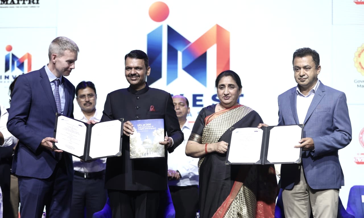MMRDA and University College London representatives display signed MoU documents at the Invest Maharashtra event